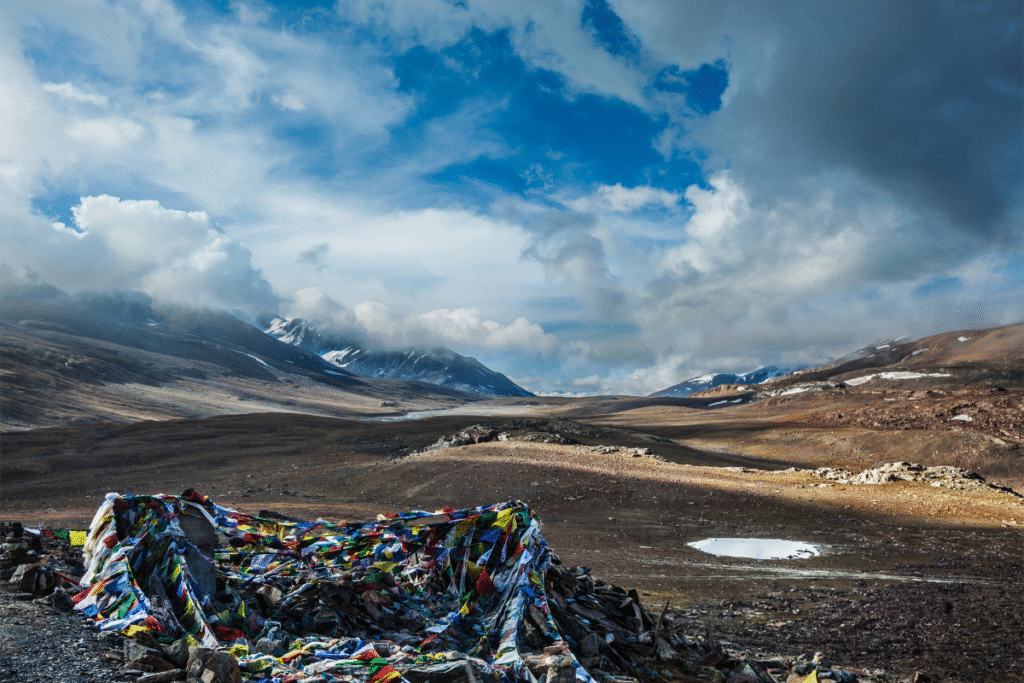 Buddhist prayer flags (lungta) on Baralacha La pass in Himalayas